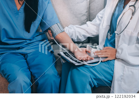 The doctor woman hand use the pulse meter to measure the pressure of the patient, medical checkup concept. 122192034