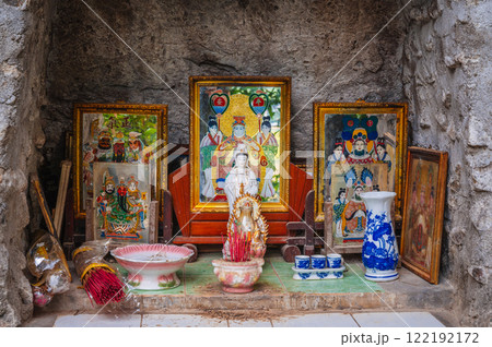 An altar with a Buddhist god outside a pagoda in Asia 122192172