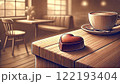 カフェのテーブルの上に置かれたコーヒーとチョコレート 122193404