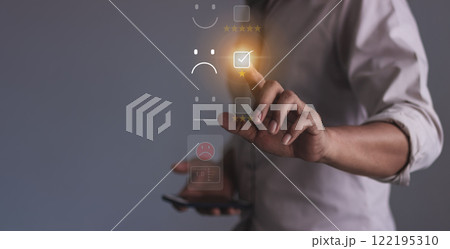 Young man hand holding smartphone to review and gives 1 star, with poor service results Young man hand holding smartphone to review and gives 1 star, with poor service results 122195310