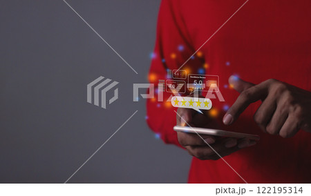 Young Man hand holding Smart Phone with five star to review and give 5 stars 122195314
