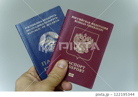 Belarusian and Russian passport. Citizenship of Russia and Belarus. Emigration, travel, work concept Belarusian and Russian passport. Citizenship of Russia and Belarus. Emigration, travel, work concept 122195344