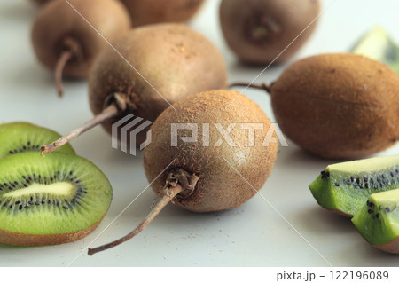 Group of kiwi with tails from home garden on white background. Eco-friendly pure natural product.  122196089