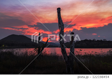 sunset over hills with dramatic sky sunset over hills with dramatic sky 122198454