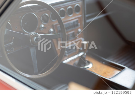 Interior of a classic vintage car with wooden details 122199593
