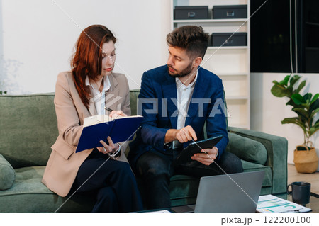 Project manager working and update tasks with milestones progress planning and professional investor working new start up project in the office. 122200100