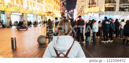 woman traveler visiting in Shanghai, China. Happy Female Tourist sightseeing in Nanjing road, shopping district of Shanghai. landmark and popular for tourism attractions. Travel and Vacation concept 122200452