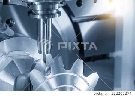 The 5-axis CNC milling machine  cutting the automotive part with solid ball end mill tool in the light blue scene. 122201274