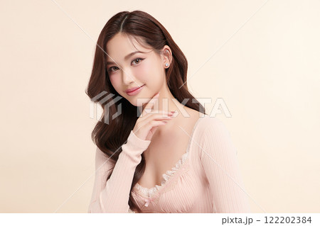 Beautiful young asian woman with clean fresh skin on beige background, Face care, Facial treatment, Cosmetology, beauty and spa, Asian women portrait. 122202384