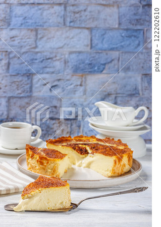 San Sebastian or Basque burnt cheesecake on plate San Sebastian or Basque burnt cheesecake on plate 122202610