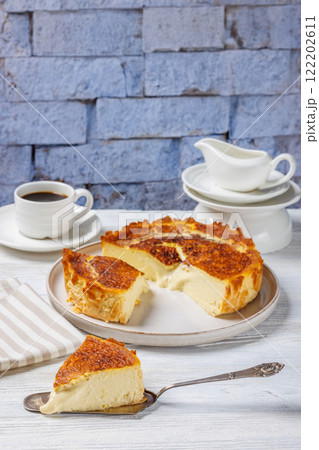San Sebastian or Basque burnt cheesecake on plate San Sebastian or Basque burnt cheesecake on plate 122202611