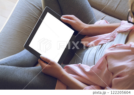 Woman using her tablet with blank of screen 122205604