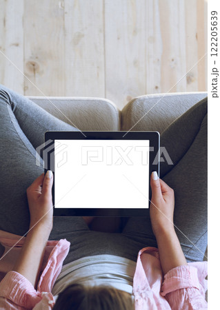 Woman using her tablet with blank of screen 122205639