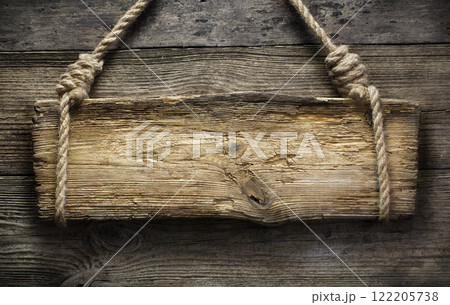 Wooden sign hanging on rope 122205738