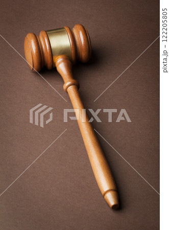 Wooden gavel on brown background Wooden gavel on brown background 122205805