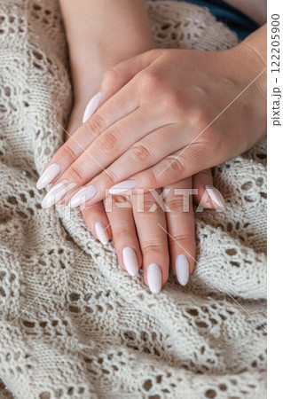 Model woman showing light pale pink nude shellac manicure on lo 122205900