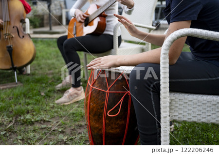 Musicians creating harmony in an outdoor jam session 122206246