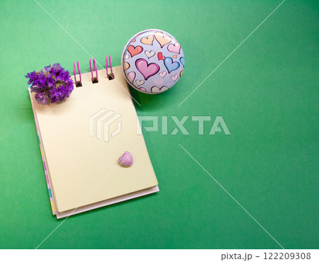 Diary in contrasting tones with background . Hearts and flowes. Copy space Diary in contrasting tones with background . Hearts and flowes. Copy space 122209308