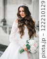 Portrait of stunning bride with long hair posing with great bouquet Portrait of stunning bride with long hair posing with great bouquet 122210129