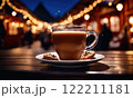 Merry Christmas and Happy Holidays. A cup of hot drink and cookies with background of the lights of Christmas market. Cup of coffee on the window sill. Bright lights of the city hristmas background. 122211181