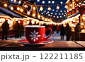 Merry Christmas and Happy Holidays. A cup of hot drink and cookies with background of the lights of Christmas market. Cup of coffee on the window sill. Bright lights of the city hristmas background. 122211185