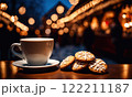 Merry Christmas and Happy Holidays. A cup of hot drink and cookies with background of the lights of Christmas market. Cup of coffee on the window sill. Bright lights of the city hristmas background. 122211187