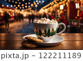 Merry Christmas and Happy Holidays. A cup of hot drink and cookies with background of the lights of Christmas market. Cup of coffee on the window sill. Bright lights of the city hristmas background. 122211189