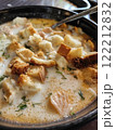 Delicious bowl of lohikeitto soup with bread croutons, close up view. Traditional Karelian and Finnish fish soup 122212832