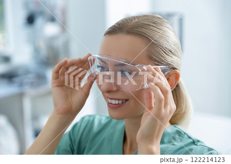 Medical woman wearing protective glasses in laboratory 122214123