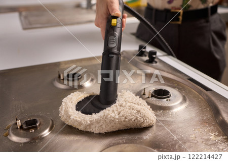 Performing a Deep Cleaning of Kitchen Equipment Using a Steam Cleaner for Hygiene and Safety 122214427