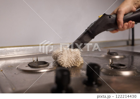 Performing a Deep Cleaning of Kitchen Equipment Using a Steam Cleaner for Hygiene and Safety 122214430