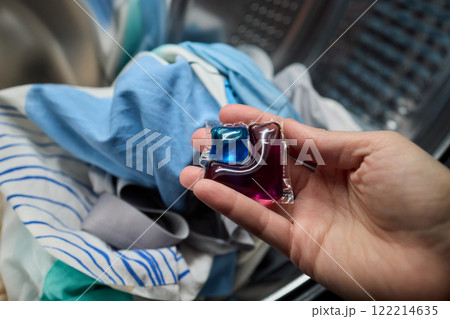 Using Laundry Detergent Pods While Doing Laundry in the Washing Machine with Clothes Using Laundry Detergent Pods While Doing Laundry in the Washing Machine with Clothes 122214635