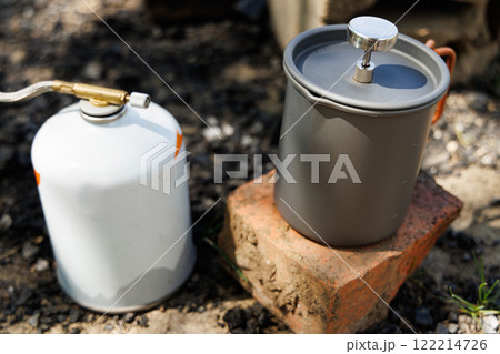 Exploring outdoor cooking with a camp stove and pot for memorable meals under the open sky Exploring outdoor cooking with a camp stove and pot for memorable meals under the open sky 122214726