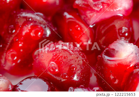 Juicy Pomegranate Seeds with Water Droplets macro shot clous up Juicy Pomegranate Seeds with Water Droplets macro shot clous up 122215653