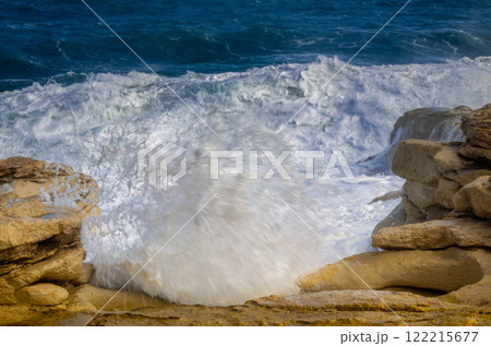 Explosive Wave Impact on Rocky Coast, Coastal Power on Rugged Rocks Explosive Wave Impact on Rocky Coast, Coastal Power on Rugged Rocks 122215677