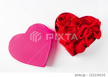 Heart shaped open gift box on white background. 122216210