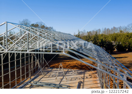 Metallic structure is taking shape as construction progresses in metal framed warehouse 122217242