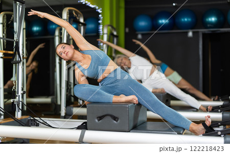 Young woman sitting on box set equipment...の写真素材 [122218423] - PIXTA