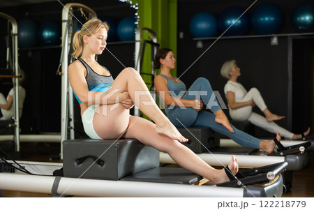 woman doing exercises for hip mobility and back 122218779