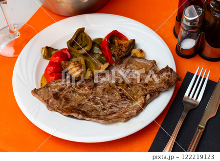 Beef steak with vegetables served in a plate 122219123