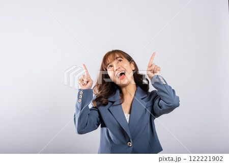Asian happy portrait beautiful cute young business woman standing makes gesture two fingers pointing upwards above presenting product something, studio shot isolated on white background, point up Asian happy portrait beautiful cute young business woman standing makes gesture two fingers pointing upwards above presenting product something, studio shot isolated on white background, point up 122221902