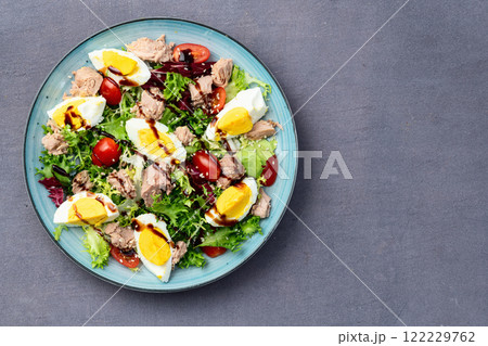 Canned Tuna salad with eggs and tomatoes photography . Top view 122229762