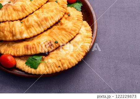Snack chebureks. Pasties with meat photography . Top view 122229873