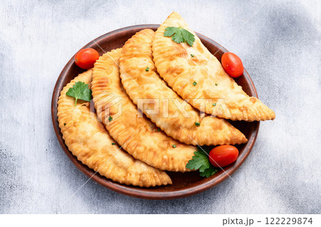 Snack chebureks. Pasties with meat photography . Top view Snack chebureks. Pasties with meat photography . Top view 122229874