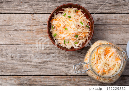 Tasty marinated cabbage with carrot, healthy food  Sauerkraut photography . Top view 122229882
