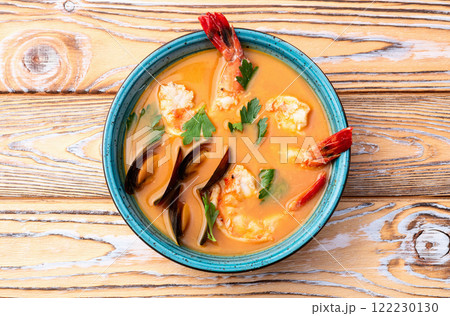 French seafood bouillabaisse soup with shrimps and mussels photography . Top view 122230130