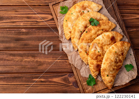Snack chebureks. Pasties with meat photography . Top view 122230141