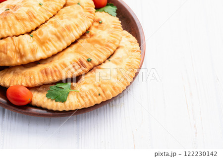 Snack chebureks. Pasties with meat photography . Top view Snack chebureks. Pasties with meat photography . Top view 122230142