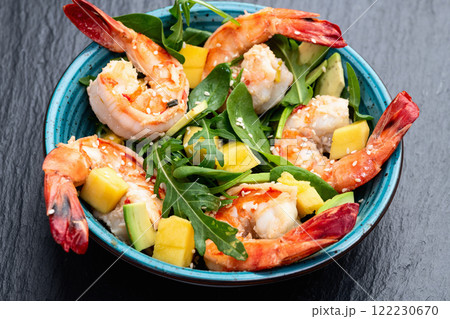 Salad with tiger shrimps , avocado and mango . Top view Salad with tiger shrimps , avocado and mango . Top view 122230670