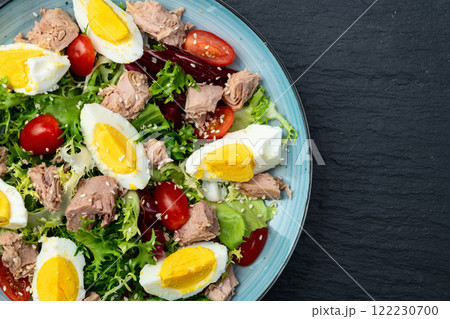 Canned Tuna salad with eggs and tomatoes photography . Top view 122230700
